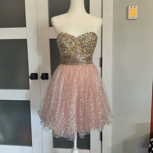 Bejeweled pink puffy strapless dress with sequins